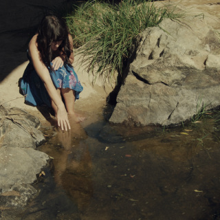 woman in natural water basin